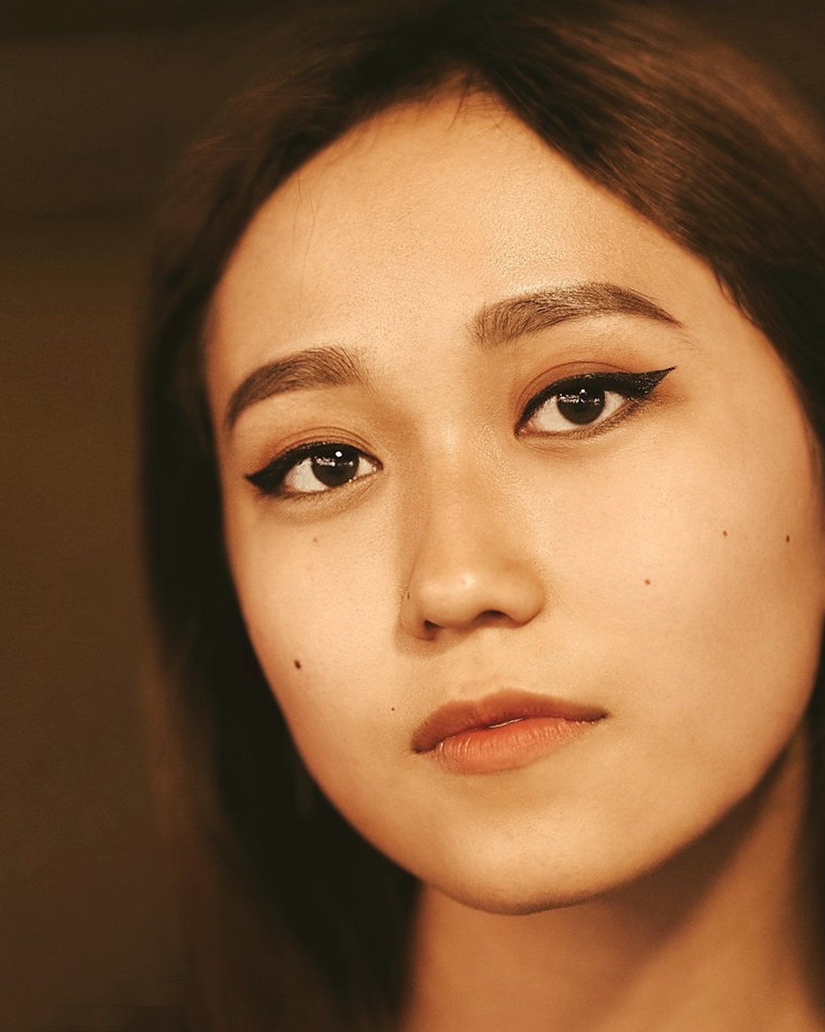 A close portrait in warm, even light