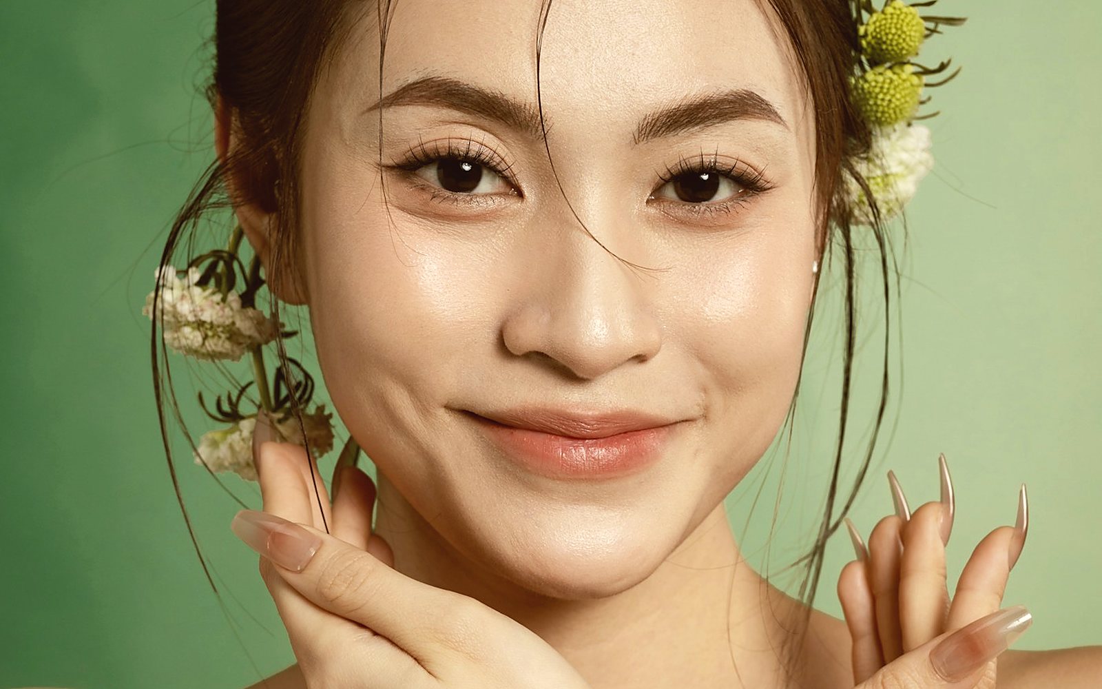 A portrait photographed in daylight, flowers at the hair